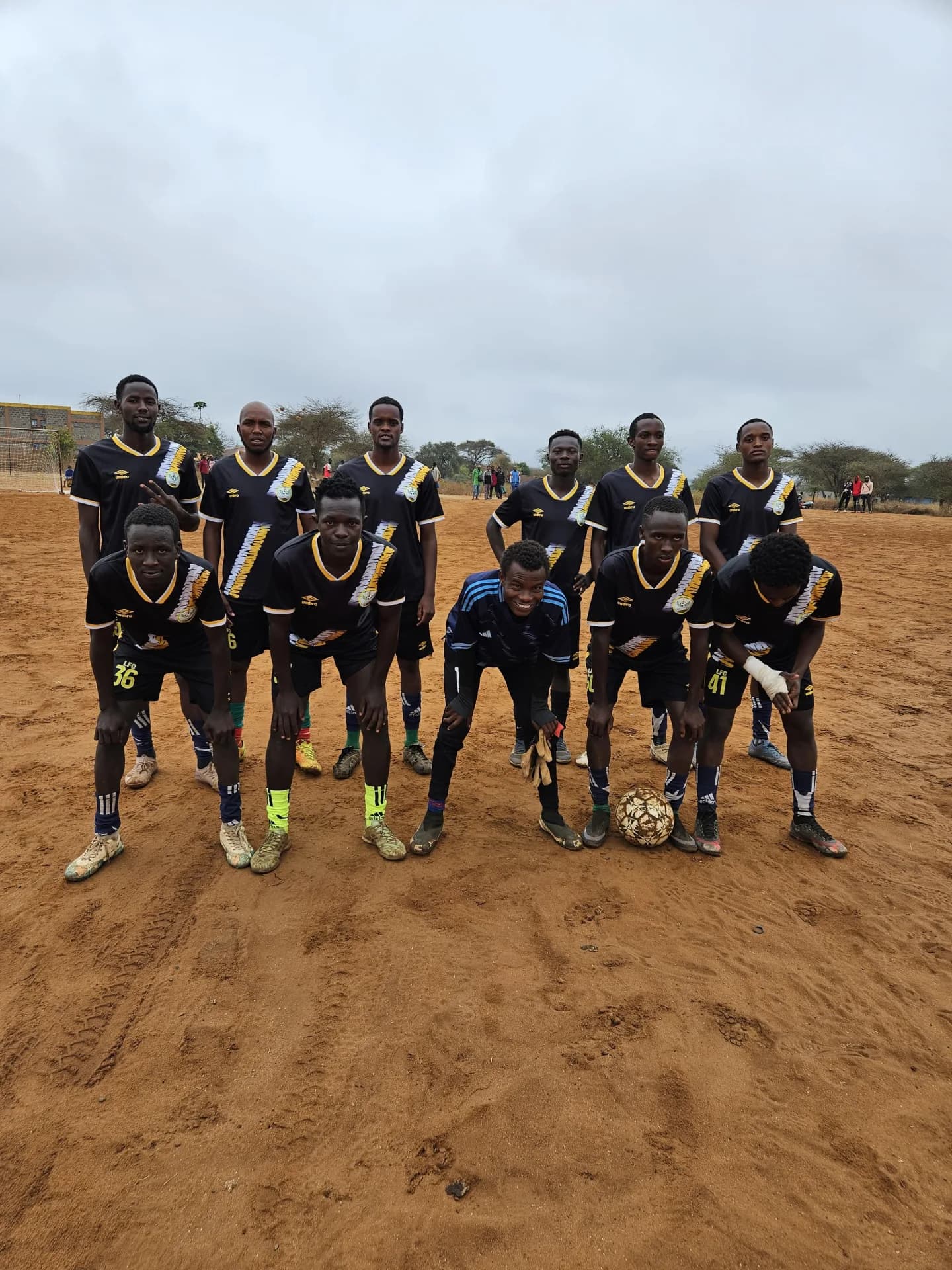 Football team in dark kits at the Maparasha tournament